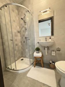 a bathroom with a shower and a sink at Marina District in Pieta
