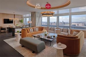 a living room with a view of a city at Park Hyatt Changsha in Changsha