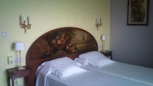 Postel nebo postele na pokoji v ubytování Hotel Grifeu