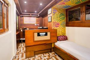 a small room with a small bed in a train at Palette by CheckIn Heritage Scindia Ghat in Varanasi
