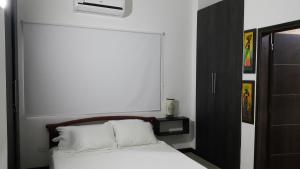 Letto o letti in una camera di Hospedaje Solymar Sarie Bay