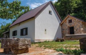 a large white house with a brown roof at Holiday House - Hidden in Velebit in Senj