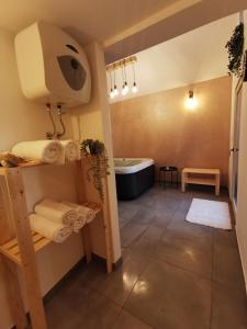 a bathroom with a shower and a toilet with towels at Holiday House - Hidden in Velebit in Senj +34 photos