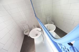 a bathroom with a toilet and a sink at Dopa Hostel in Bologna