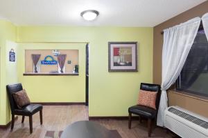 a living room filled with furniture and a window at Econo Lodge Inn & Suites in Yankton