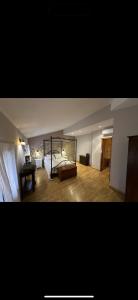 a large room with a bed and a table at Casa rural marga in Tardienta