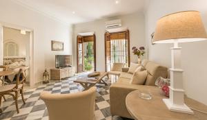 a living room with a couch and a table at Apartamento Garcia Lorca Granada in Granada