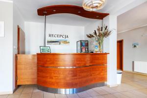 a lobby with a reception desk in a building at Willa Chantal in Jastrzębia Góra