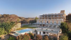 an aerial view of a building with a swimming pool at Fateh Safari Resort by Fateh Collection in Kumbhalgarh