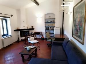 a living room with a couch and a table at Antico Mulino in Imperia +29 photos