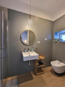 a bathroom with a sink and a mirror at B&B Luna Rossa in Altamura +61 photos