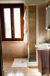 a bathroom with a shower and a sink at Casa Effe in Cecina +22 photos
