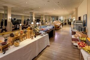 a store filled with lots of different types of food at Sunday Hotel des Nordens in Flensburg