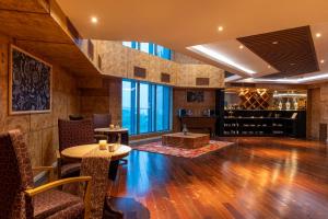a wine tasting room with a table and chairs at Vivanta Hyderabad, Begumpet in Hyderabad
