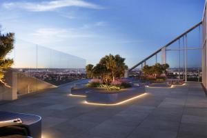 a view of the city from the roof of a building at Estrel Tower in Berlin +16 photos
