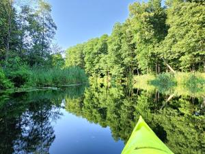 a view of a river from the inside of a kayak at Domki Letniskowe Nika in Mikołajki