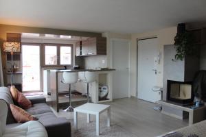 a living room with a couch and a table at Panoramic Luxury Little Penthouse in Florence