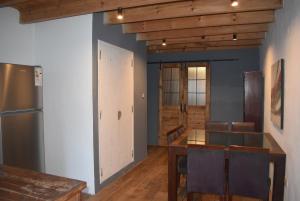 a dining room with a table and a refrigerator at Cocina Bajo las Estrellas in Martínez +16 photos
