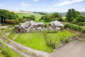 an aerial view of a house on a green field at Sunflowers Barn in Looe