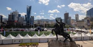 a statue of a man riding a horse in a city at Shaanlda in Ongon