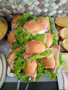 a bunch of sandwiches sitting on a plate at Porto Pousada in Ipojuca
