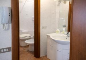 a bathroom with a sink and a toilet at Milano in Saronno