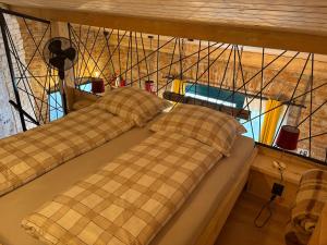 a room with two beds in a room with aigunigun at Apartmán u Ondrika in Spišské Tomášovce