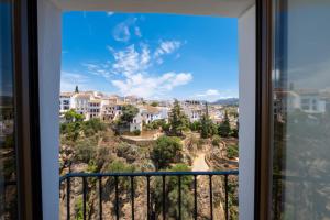 a balcony with a view of a city at GAV Santa Pola in Ronda