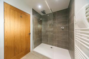 a bathroom with a shower with a glass door at The Star House in Glendale +37 photos