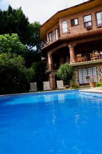 The swimming pool at or close to Hotel Casa del Angel