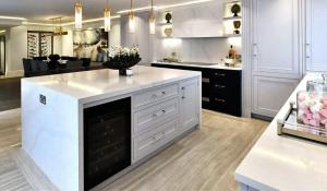a kitchen with white cabinets and a white counter top at Kos blue & green in Kos