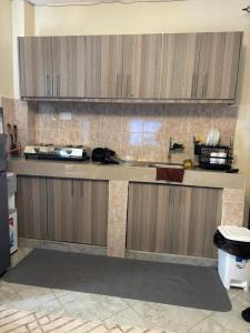 a kitchen with a sink and a counter top at Sitati in Ruaka