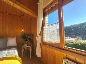 a room with a bed and a window with a view at Encanto en el Moncayo in San Martín de Moncayo