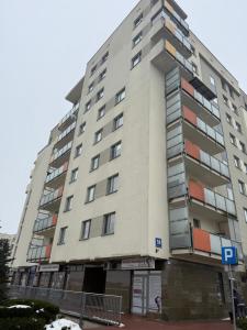 a large apartment building in front of a street at UniqueView Apartament Jana Pawła in Białystok