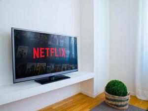 a television sitting on a white shelf in a living room at Bartolo Suite Centro Storico Perugia in Perugia
