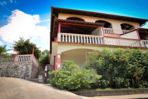 a house with a balcony on the side of it at Apartments in Lopar - Insel Rab 36282 in Lopar