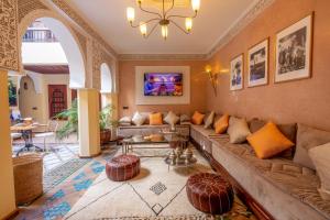 a living room with a couch and a table at Riad Amalia in Marrakesh