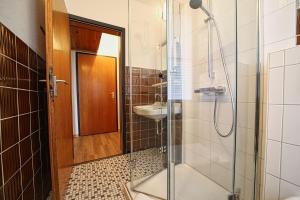 a bathroom with a shower and a sink at Appartement-3 in Süddorf +10 photos
