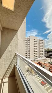 a balcony with a view of a building at House098 in São Luís