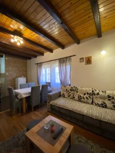 a living room with a couch and a table at Brvnara Sofiana in Bajina Bašta