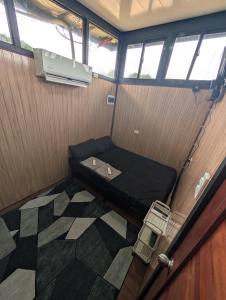an overhead view of a small room with a bed at The G Residence in Calatagan