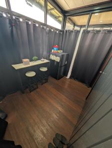 an office with a table and two stools in a room at The G Residence in Calatagan