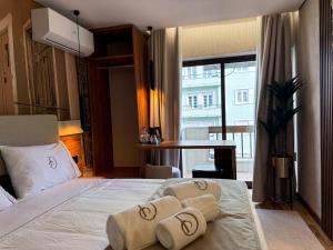 a bedroom with a bed with two pillows on it at Dom João Glamour Hotel in Lisbon +39 photos