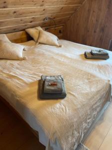 a bed with two bags on top of it at Stöckli Gantrisch-Blick in Rüeggisberg