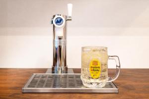 a drink in a glass sitting on top of a counter at The Lake House 野尻湖 in Shinano