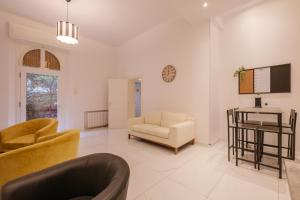 a living room with a couch and a chair at A Casa Gualandi in Bologna