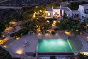 an aerial view of a house with a swimming pool at Morfia Villas in Piso Livadi