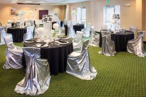 a room filled with tables and chairs in a room at Fairfield Inn & Suites Atlanta McDonough in McDonough +35 photos