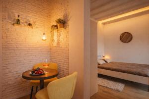 a small room with a table and a bed at Little Urban Home in Trieste