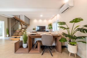 a home office with a desk and a staircase at Holiday home in Supetar in Supetar